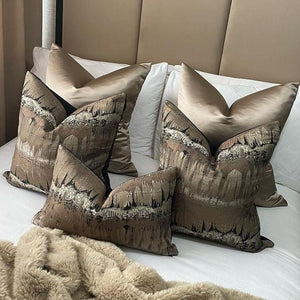 luxury cushions arranged neatly on a bed